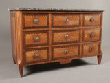 an image of a wooden chest of drawers with marble top