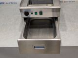 an image of a commercial electric fryer with the door open