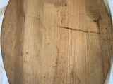 a large wooden cutting board on a white cloth