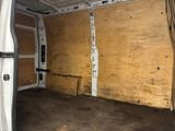 a white van with a wooden panel in the back of it