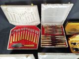 many different types of knives and knives in a case