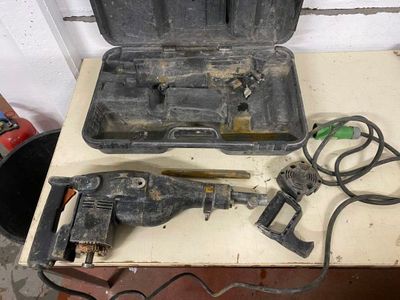 a tool that is sitting on a table next to a tool box