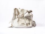 they are white bags on a white surface with a white background