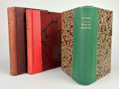 three books that are sitting next to each other on a table