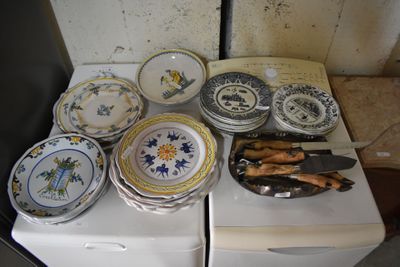 a white stove with a bunch of plates on top of it