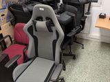 many different types of office chairs in this room