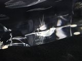 a clear piece of glass that is sitting on a black surface
