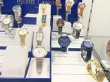 a lot of watches on display in a display case