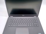 a dell laptop computer with a keyboard on it