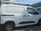 a picture of a white van parked in a parking lot