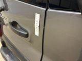 an image of a car door handle with a sticker on it