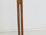 a wooden table with a glass top and a wooden base