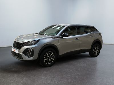 a silver suv parked in a room with a white wall