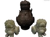 three statues of lions and a urn on a white background