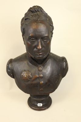 statue of a bust of a man with a flower on his chest