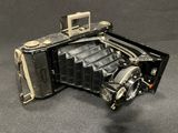 an old camera that is sitting on a table