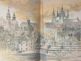 an open book with a picture of a city in it