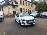 a white car that is parked in front of a building