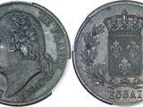a close up of a coin with a crown on top of it