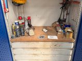 a small workbench with a lot of tools on it