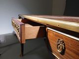 a desk with a drawer on it in a room