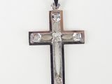 a close up of a cross on a white background