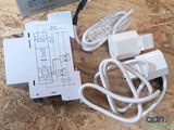wires and plugs are connected to an electronic device on a wooden surface