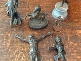 a lot of figurines that are on a wooden table