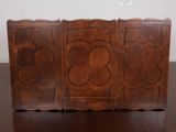 a wooden box that has a design on it