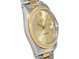 an image of a gold and silver rolex watch on a white background