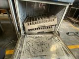 a dirty oven that has a bunch of dirty dishes inside of it