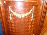 a wooden cabinet with a mirror on top of it