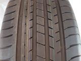 a close up of a car tire on a white surface