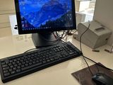 a desktop computer sitting on a desk with a mouse and keyboard