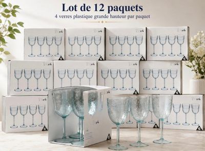 a lot of wine glasses that are sitting on a table
