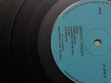a black record with a blue label on it