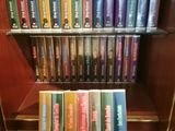 a lot of books on a shelf in a library