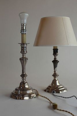 two lamps that are sitting on a white table