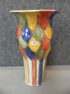 a colorful vase that is sitting on a table