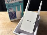 a box with a wireless router on it and a box with a wireless router on it