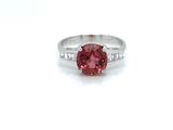 an image of a pink diamond ring with diamonds on the band