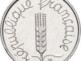 an image of a coin with a picture of a plant on it