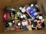 a cardboard box full of assorted items in it