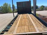 a flatbed truck with a flat bed on the back of it