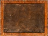 an old wooden frame with a black background and a brown background