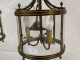 pair of antique brass hanging lanterns with glass shades