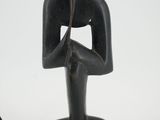 two figurines that are sitting next to each other