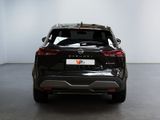 the back end of a black nissan suv parked in a room