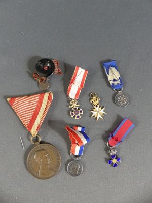 a lot of medals that are on a table