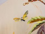 a painting of a butterfly and a dragonfly on a table
